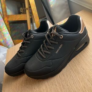 Skechers Women’s Wedge Slip-on Sneakers, black and gold. Brand new. Size 7